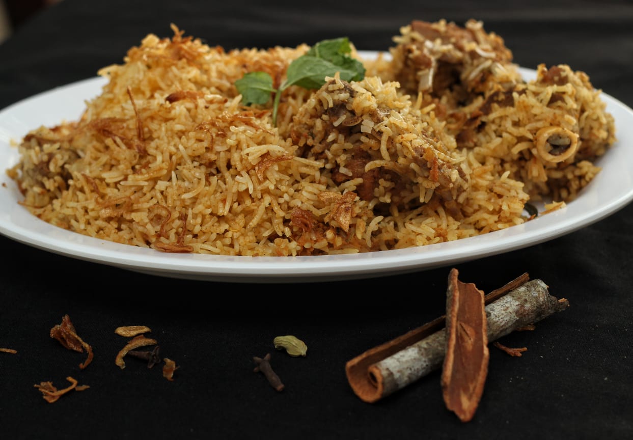 Plate of mutton dum biryani with whole spices