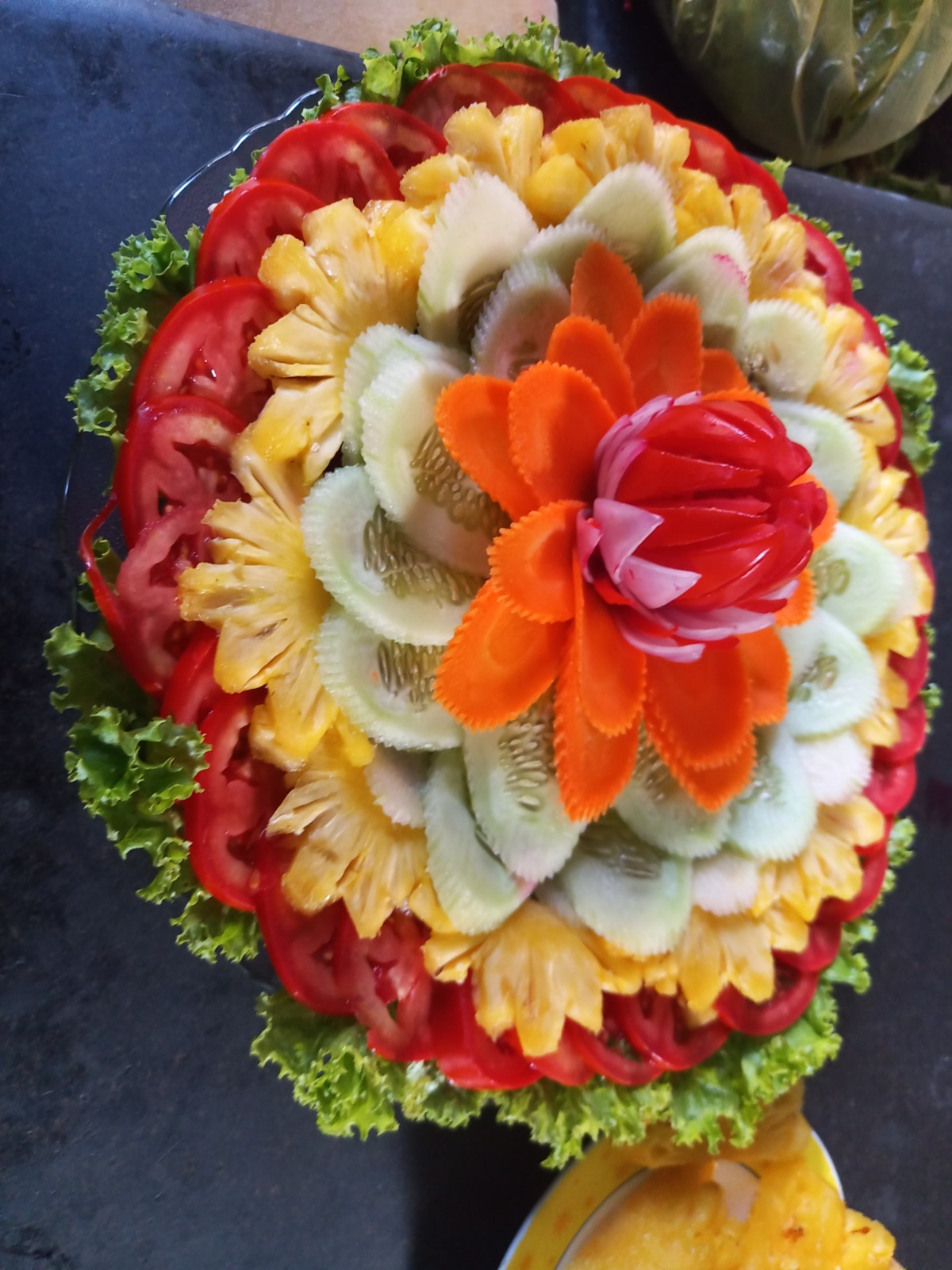 Carved vegetable and pineapple salad flower platter