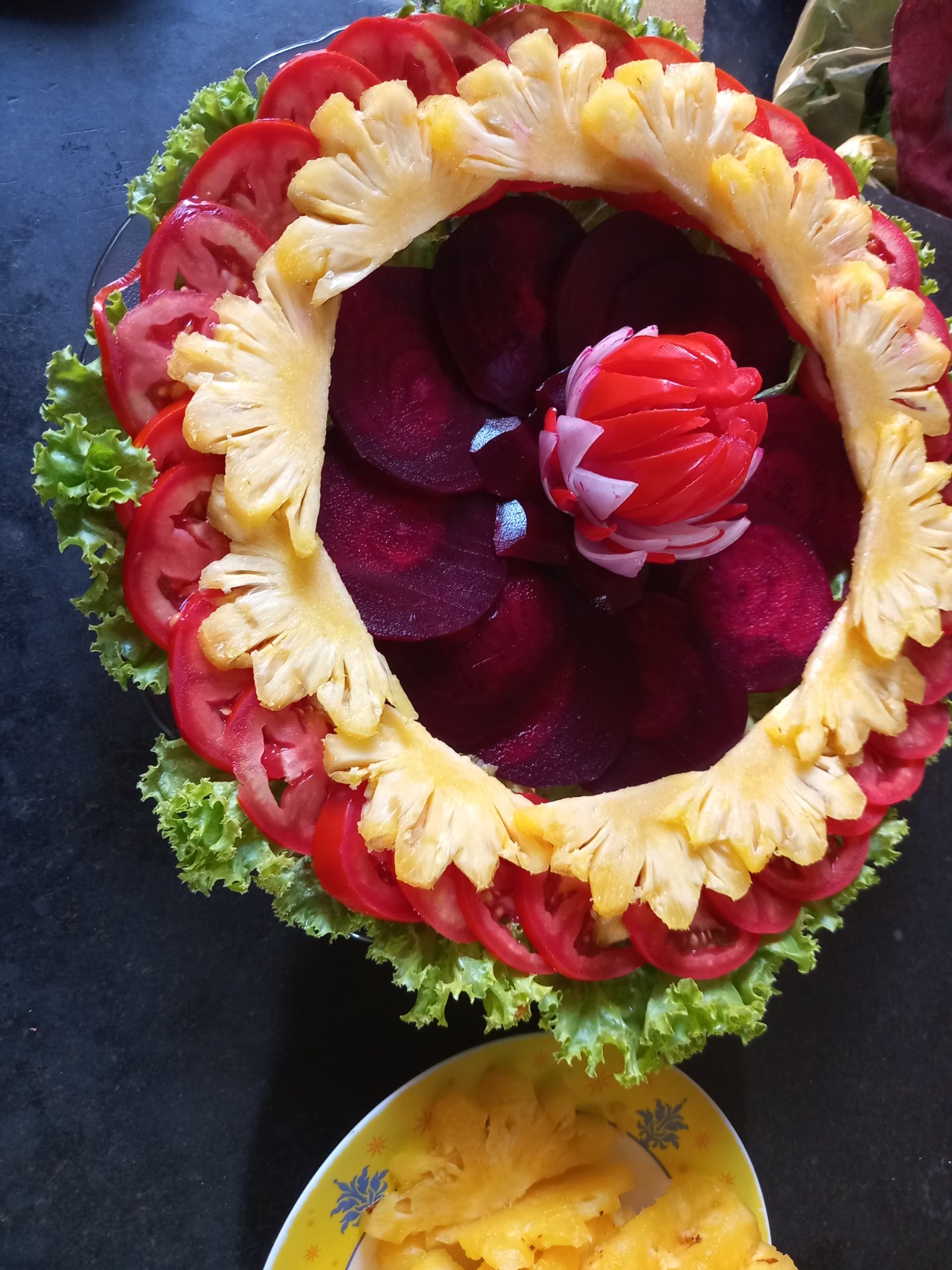 Pineapple and beetroot salad basket with a carved radish rose