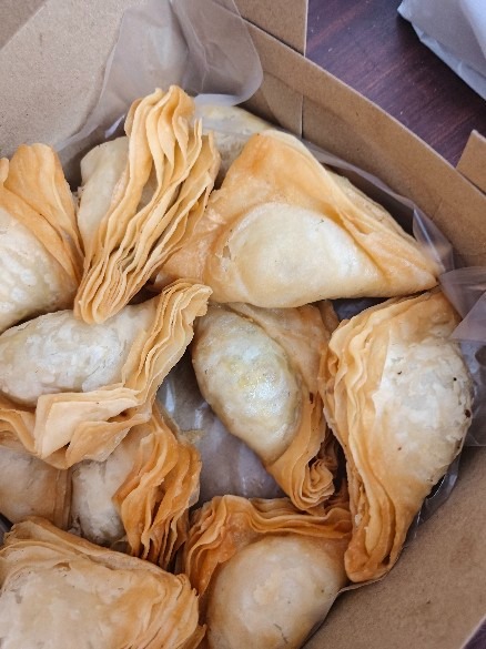 Box of layered warki puff samosas