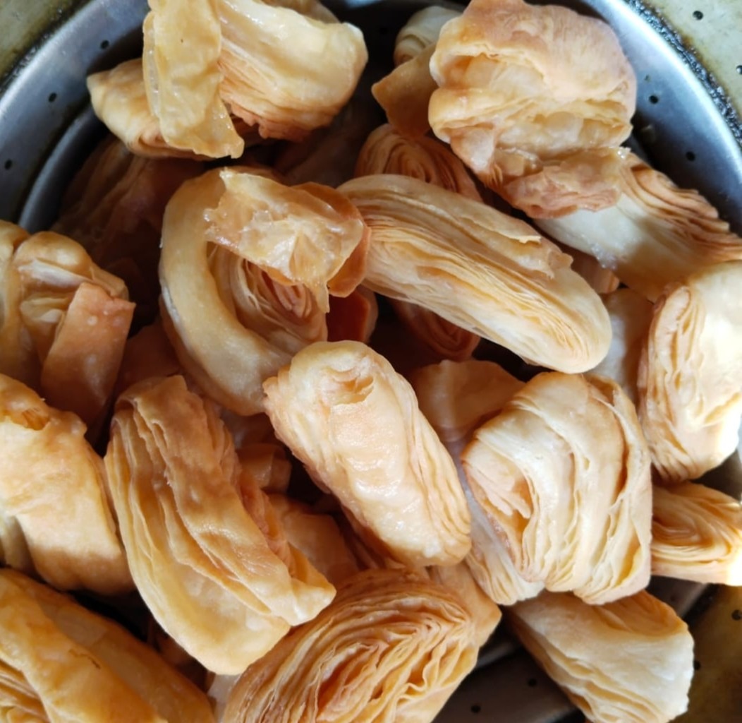 Flaky layered warki pastries in a tray