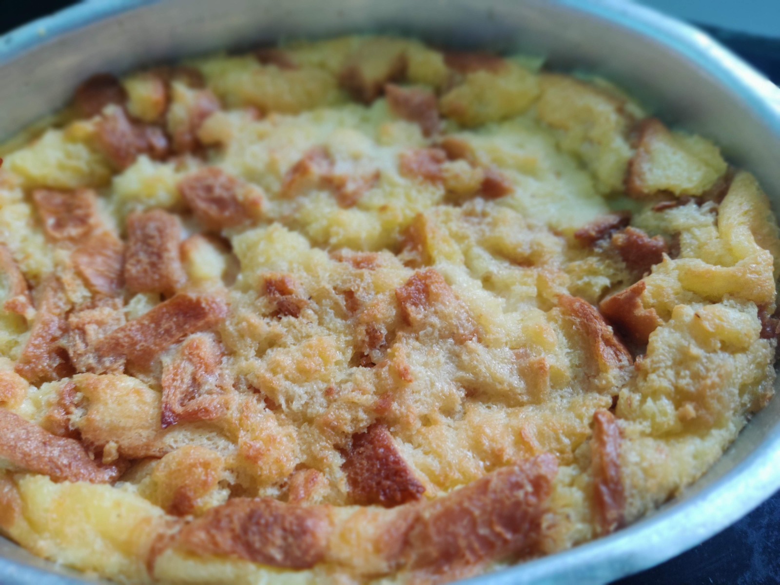 Baked bread pudding dessert in a tray