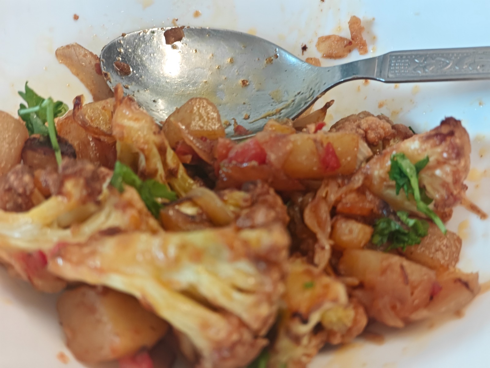 Home style aloo gobi masala with tomatoes and coriander
