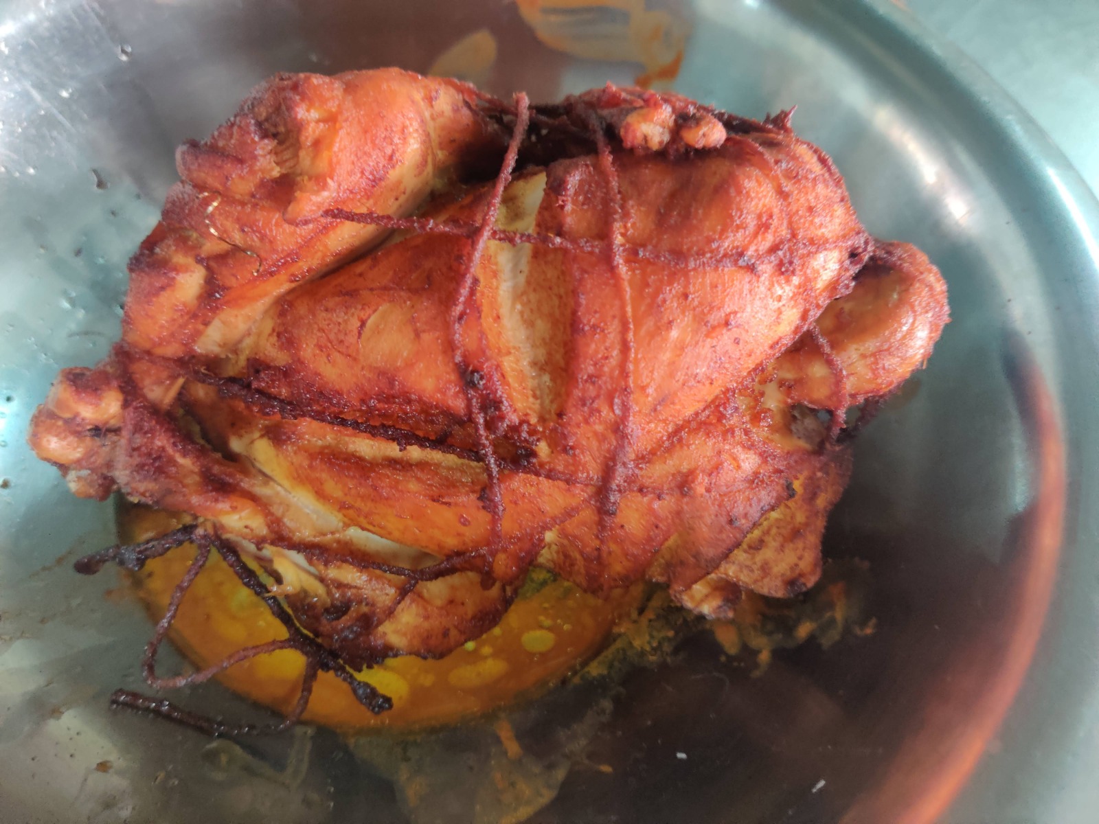 Whole marinated roast chicken tied and roasted