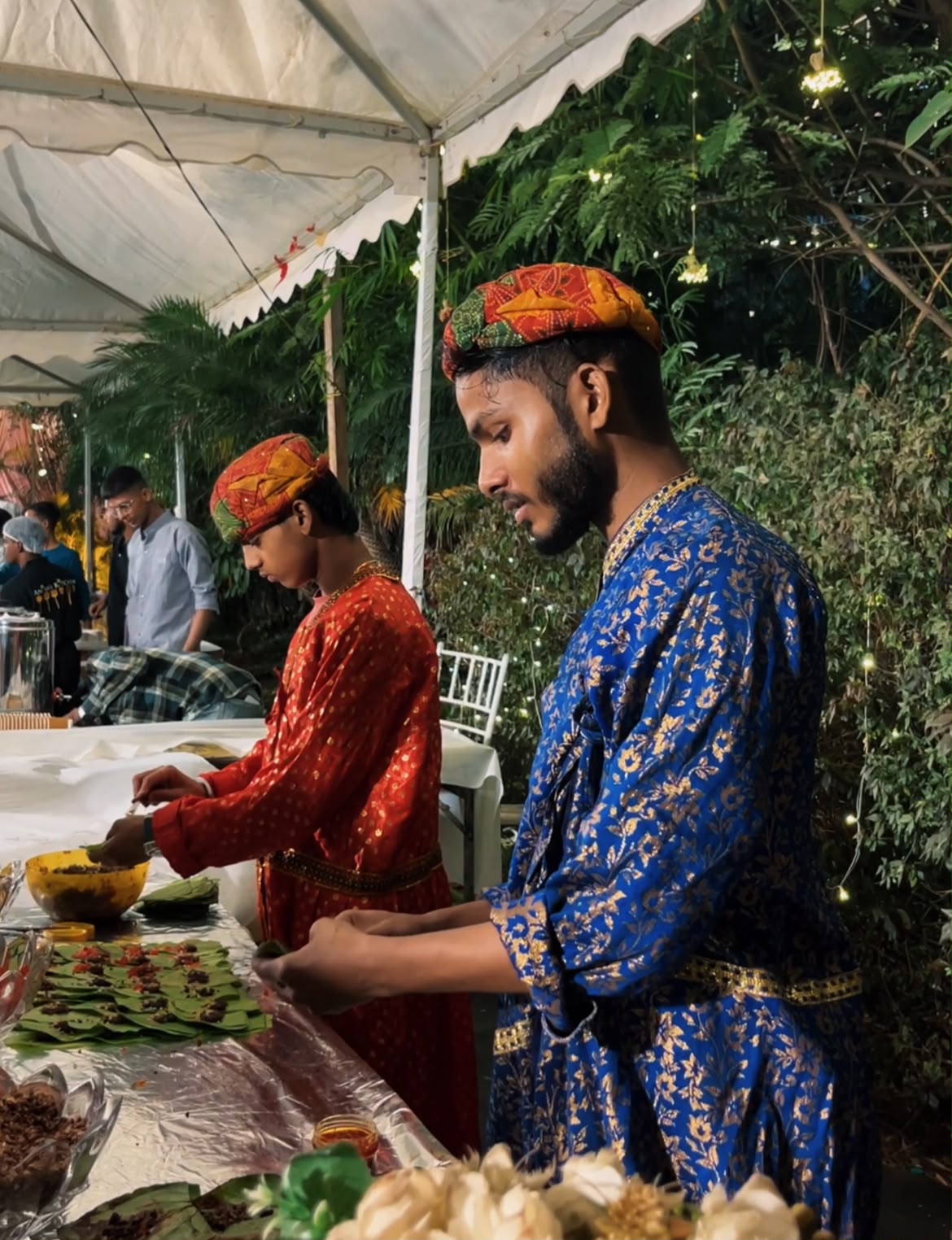 Live paan counter with traditionally dressed servers
