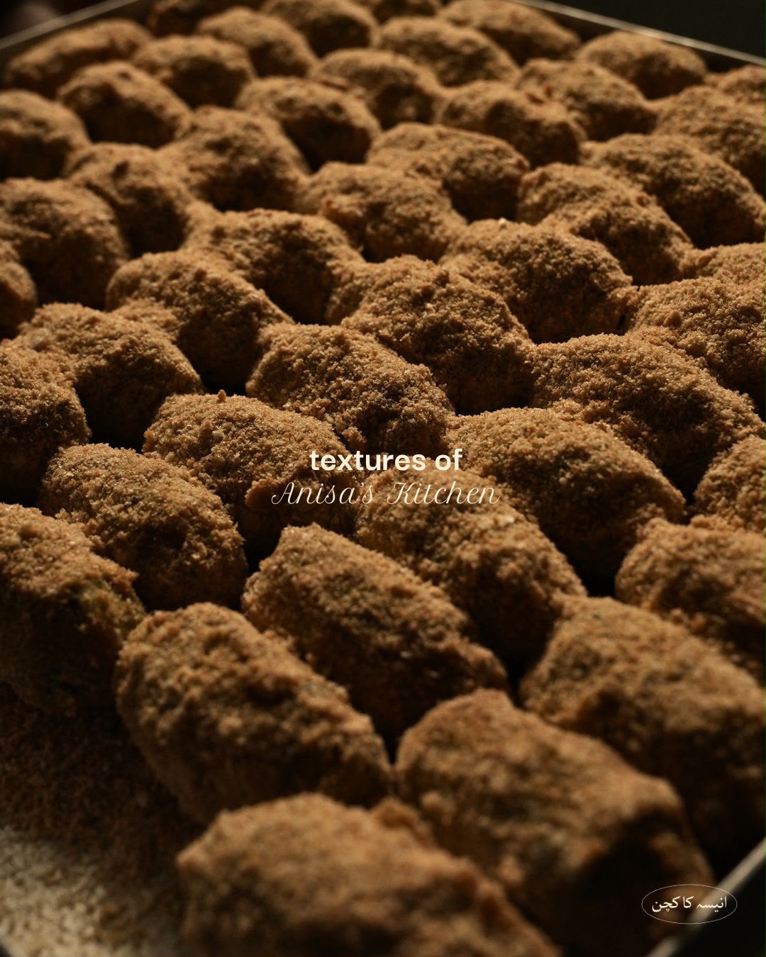 Tray of crumb coated kababs ready to fry