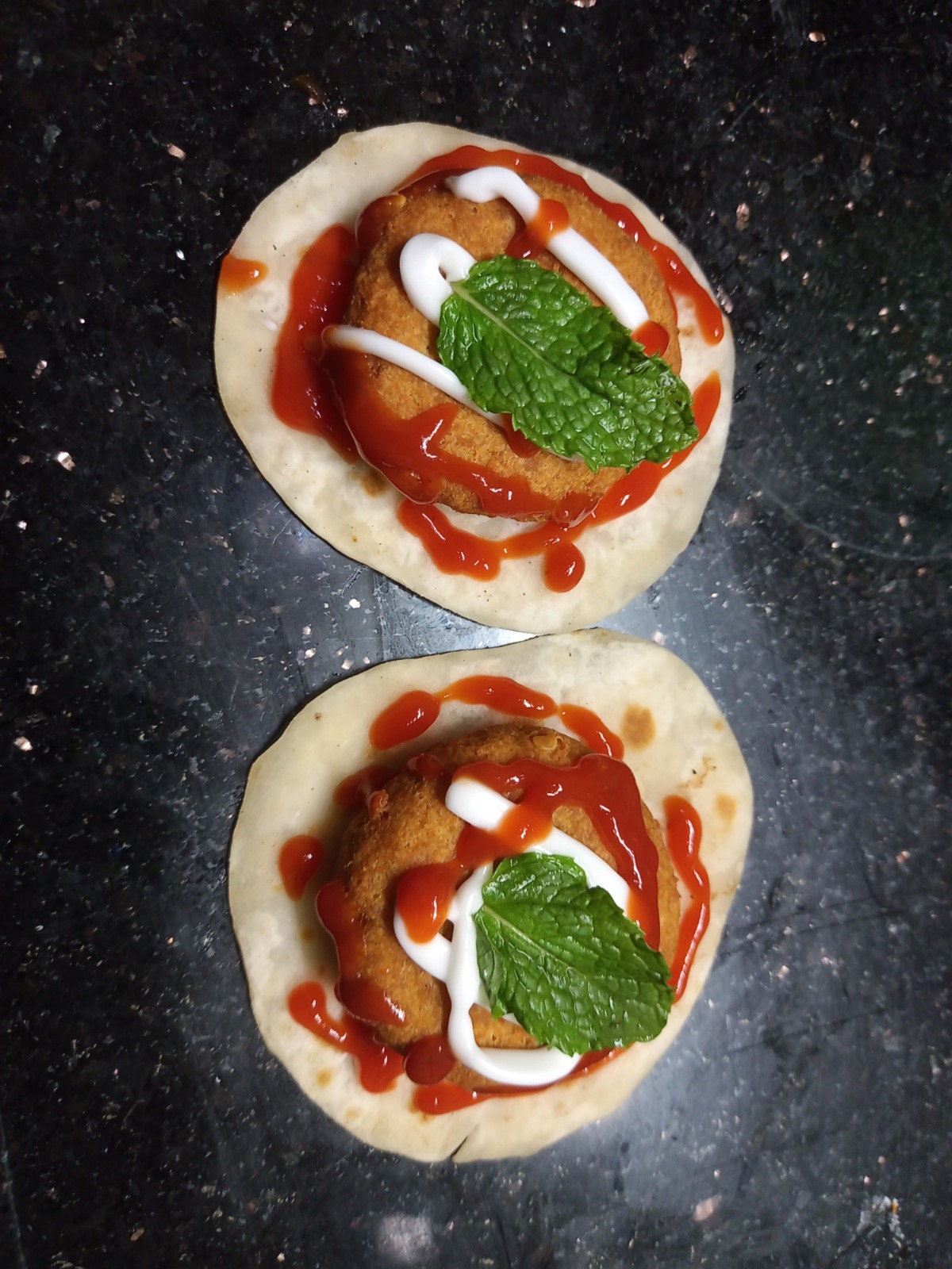 Crumb fried cutlet tostadas with sauce and mint