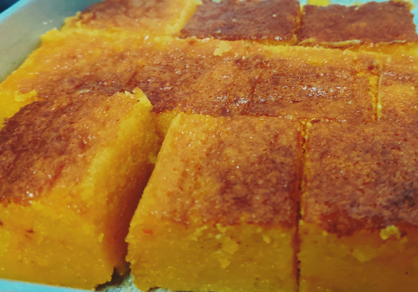 Squares of golden mango halwa